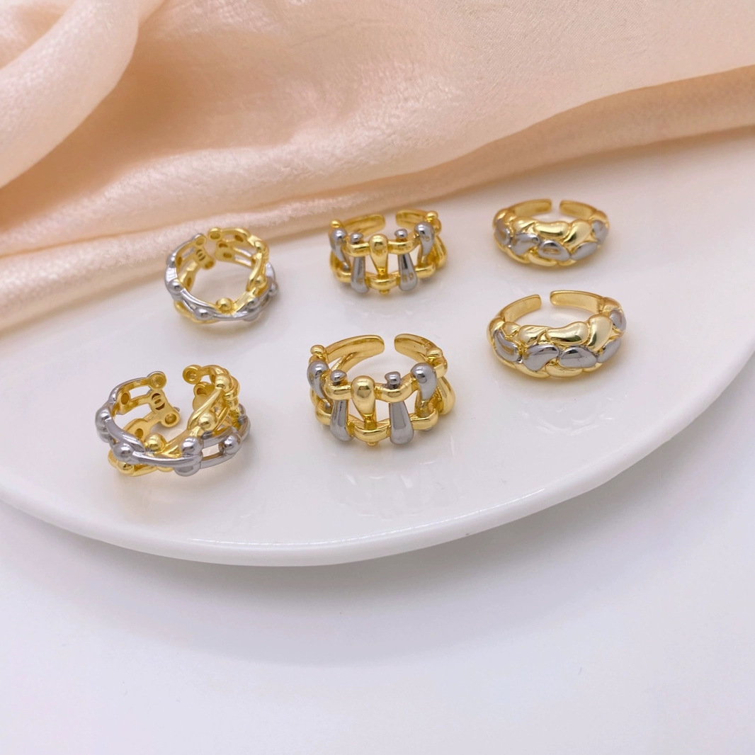 This is a niche design for women, featuring a high-end and fashionable European and American style. It is a unique hollowed-out woven ring with copper plating and 18K gold details Picture