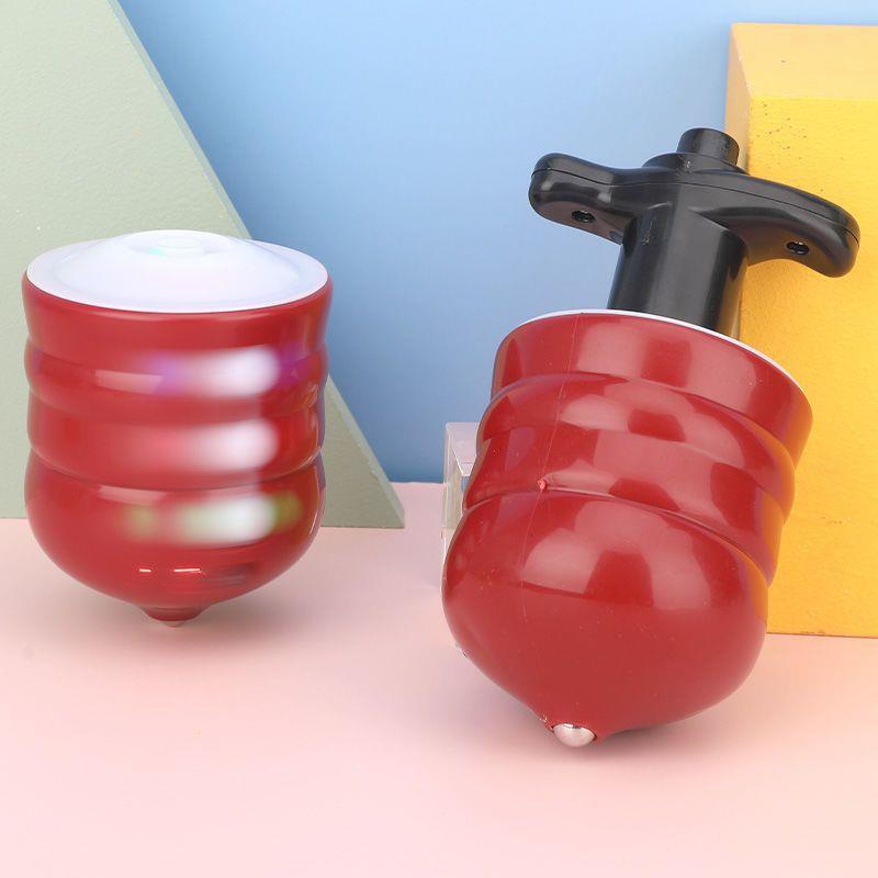 The popular music glowing wood-like gyroscope is selling well at street stalls. It is a toy of the same style as Douyin, the seven-color flashing ejector gyroscope