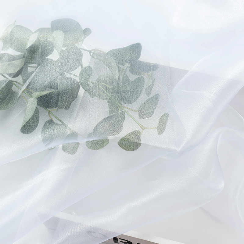 现货三根纱闪光欧根纱硬纱舞台布料服装面料纯色透明纱婚庆装饰细节图