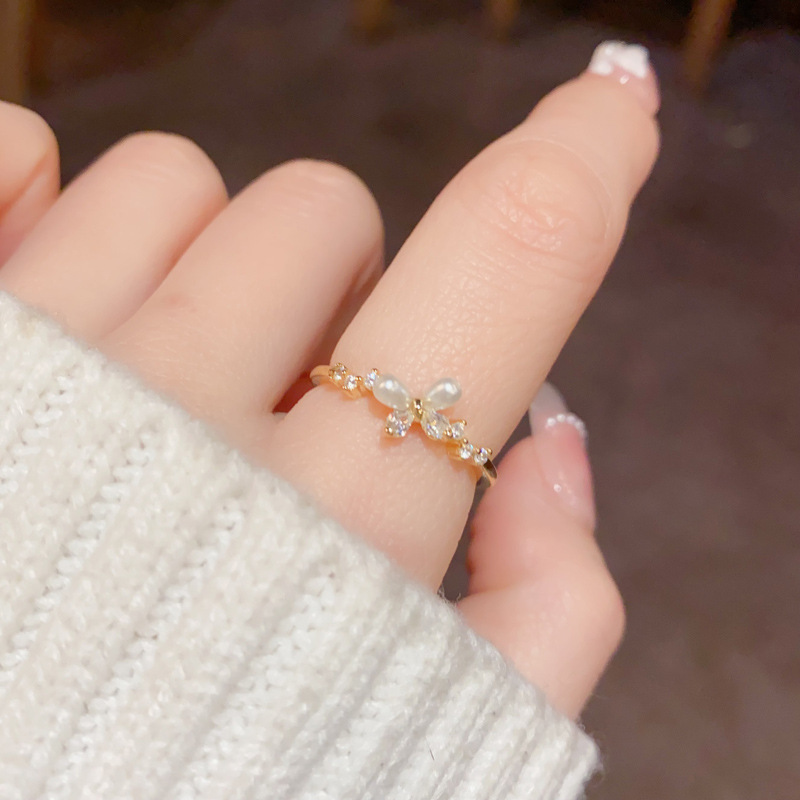 Korean-style, fashionable, sweet and versatile diamond-encrusted pearl butterfly opening ring, personalized and light luxury design index finger ring wholesale