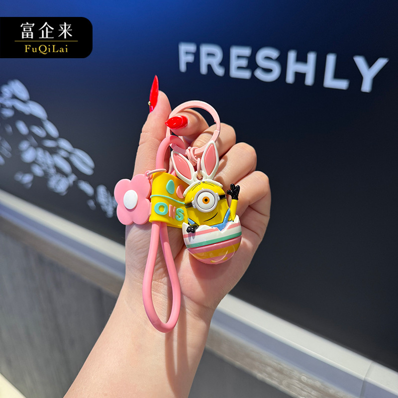 Wholesale of genuine cartoon egg Minions keychains, creative couple bags, figurines, key chains and pendants from Fuqilai Specification image