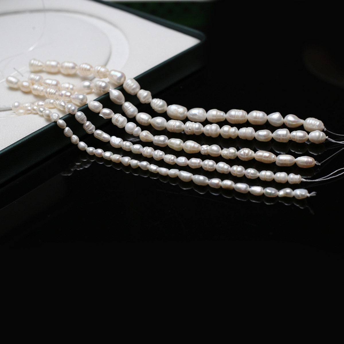 Bulk wholesale of natural freshwater rice-shaped pearl loose beads with tassel necklaces and headwear, DIY beaded hairpins materials details Picture