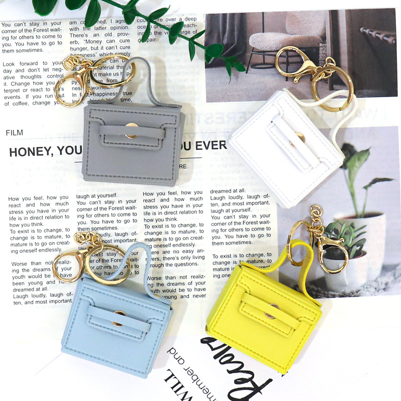 Huayang's new multi-functional small square bag features a creative mouth, red envelope, keychain, earphone bag, and a car-carrying pu key chain pendant details Picture