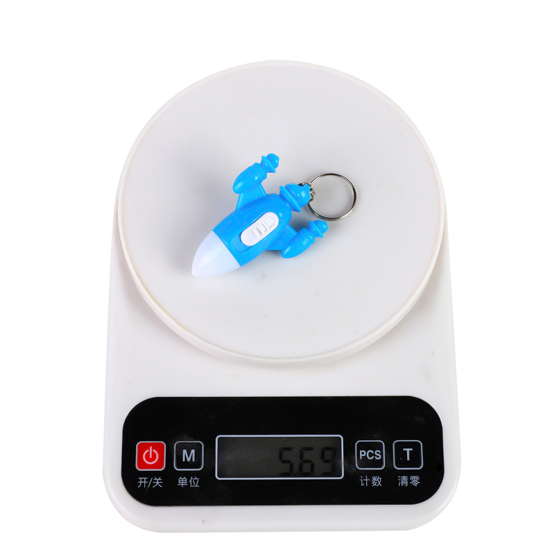 Wholesale of plastic small flashlights, wall-mounted luminous lamps, colorful spaceship keychains, led lights, flashlights and luminous gifts details Picture