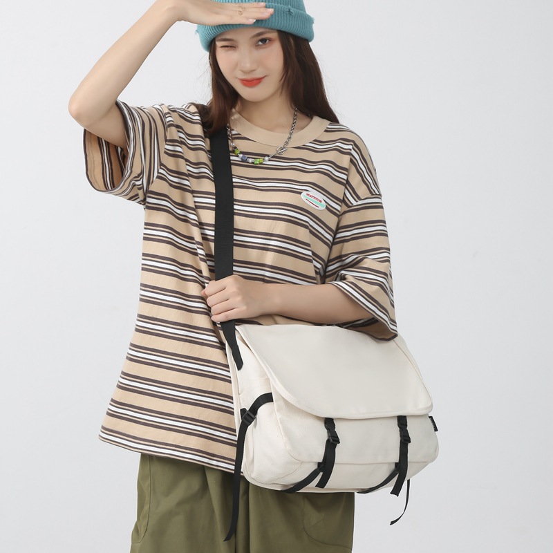 斜挎包男潮牌ins日系简约大容量单肩包学院风邮差包尼龙书包女生邮差包女包男包外贸包包产品图