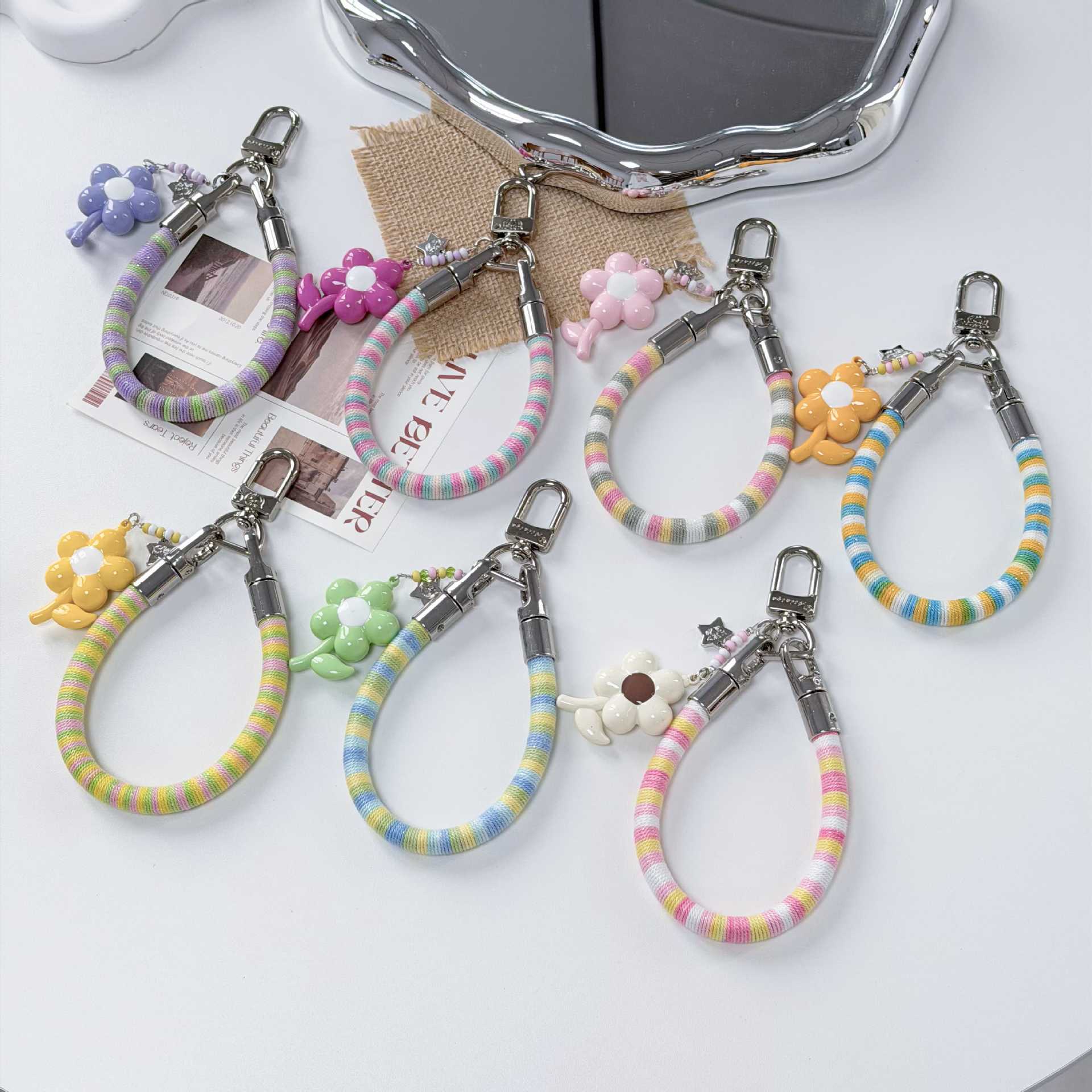 Cotton loop woven mobile phone lanyard, bracelet, small flower pendant, cute and versatile lanyard, bag pendant, anti-loss and firm