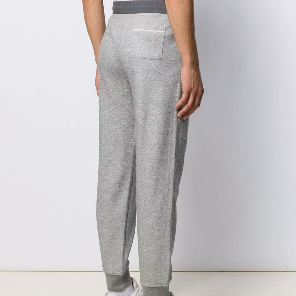 The European station's autumn collection features a new trend of simple and fashionable embroidered color-blocking, tight-waisted, drawstring, and tight-fitting men's business casual pants details Picture