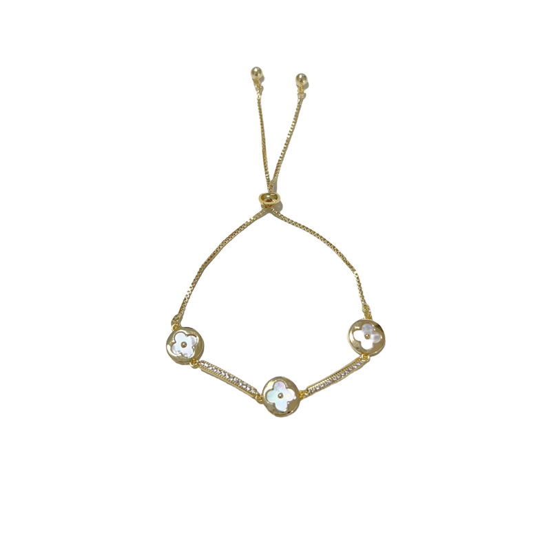 This Korean-style sweet, versatile and elegant zirconium shell four-leaf flower pull-out bracelet is a stylish and fashionable design accessory Item Picture