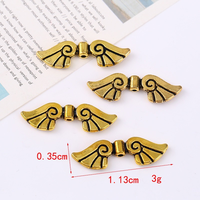 Wholesale of retro imitation Thai silver alloy angel wing beads and loose beads DIY bracelet and necklace accessories from the manufacturer details Picture