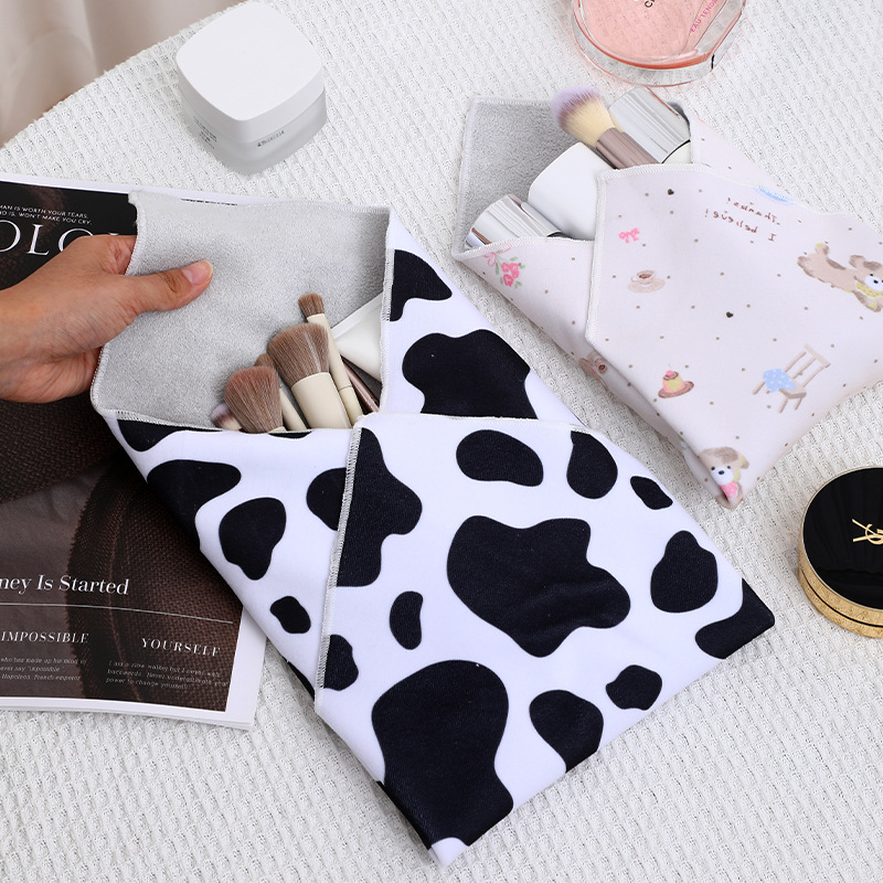 百粘布化妆品相机平板收纳包百折不变形狂甩不掉奶牛纹懒人收纳袋