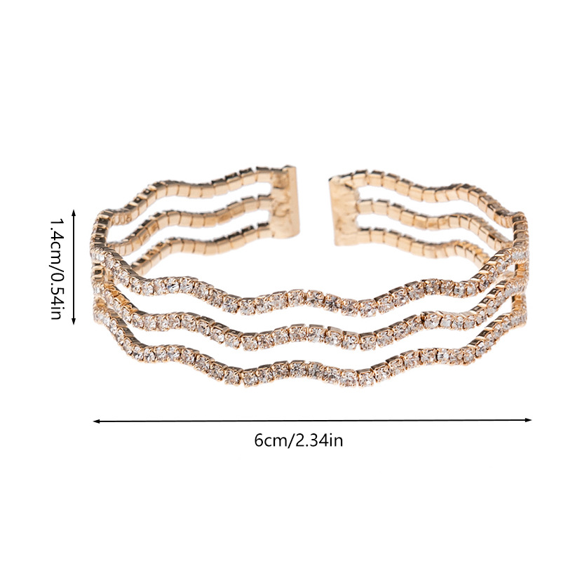 The manufacturer supplies cross-border classic 3-row wavy elastic water diamond bracelet for women, with a European and American style. It is a round opening steel wire elastic design sense jewelry Item Picture