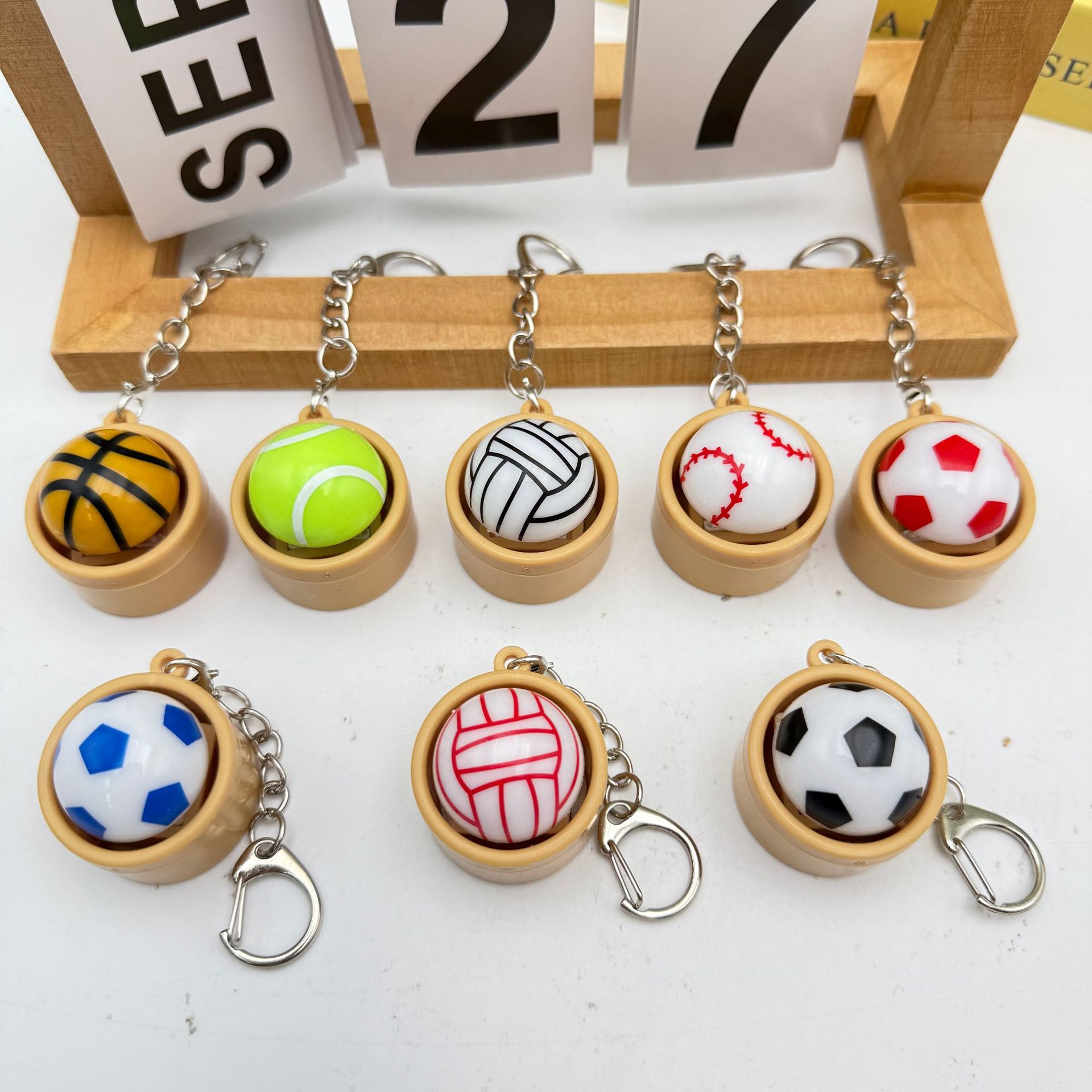 Cross-border stress-relieving buttons, football, basketball buns, softball, tennis, volleyball, stress-relieving buttons, toys, keychains