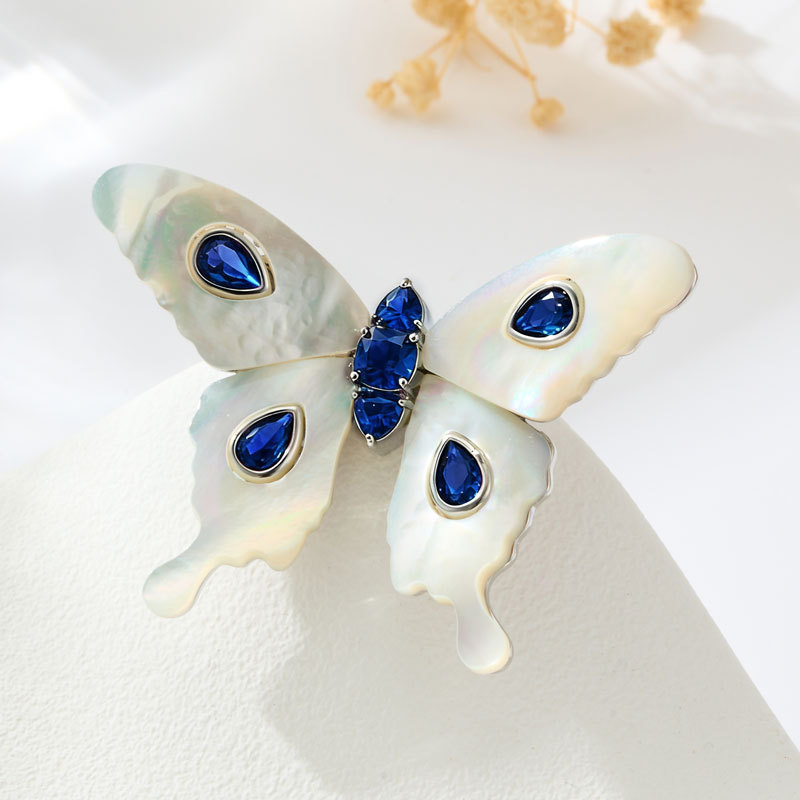 A light luxury and high-end natural mother-of-pearl butterfly brooch, an original design of copper alloy with zirconium emerald blue spinel Application Scenario