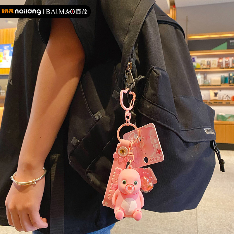 Genuine stress-relieving bubble-blowing pink milk dragon keychain, cute and creative female stress-relieving figurine key chain pendant details Picture