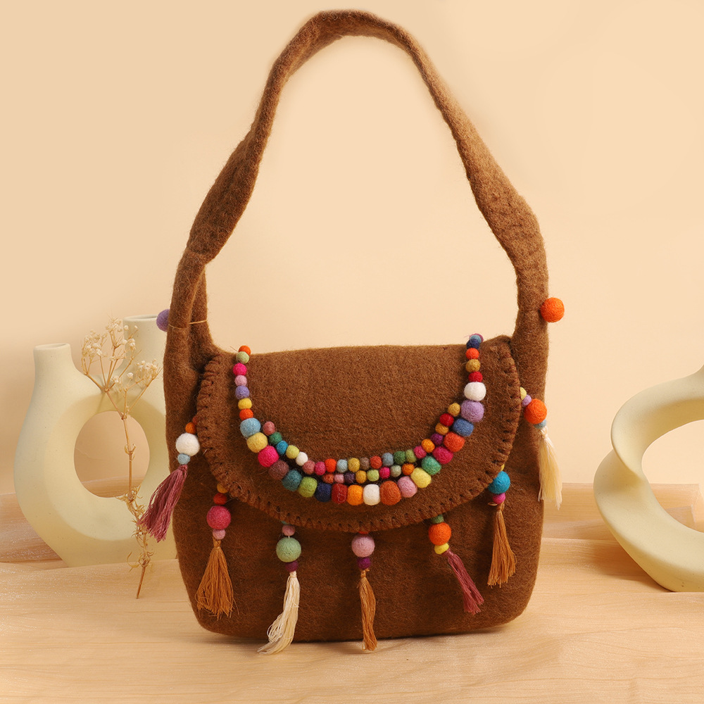 民族风羊毛毡挎包尼泊尔手工羊毛毡包包精致羊毛毡手拿包厂家直销