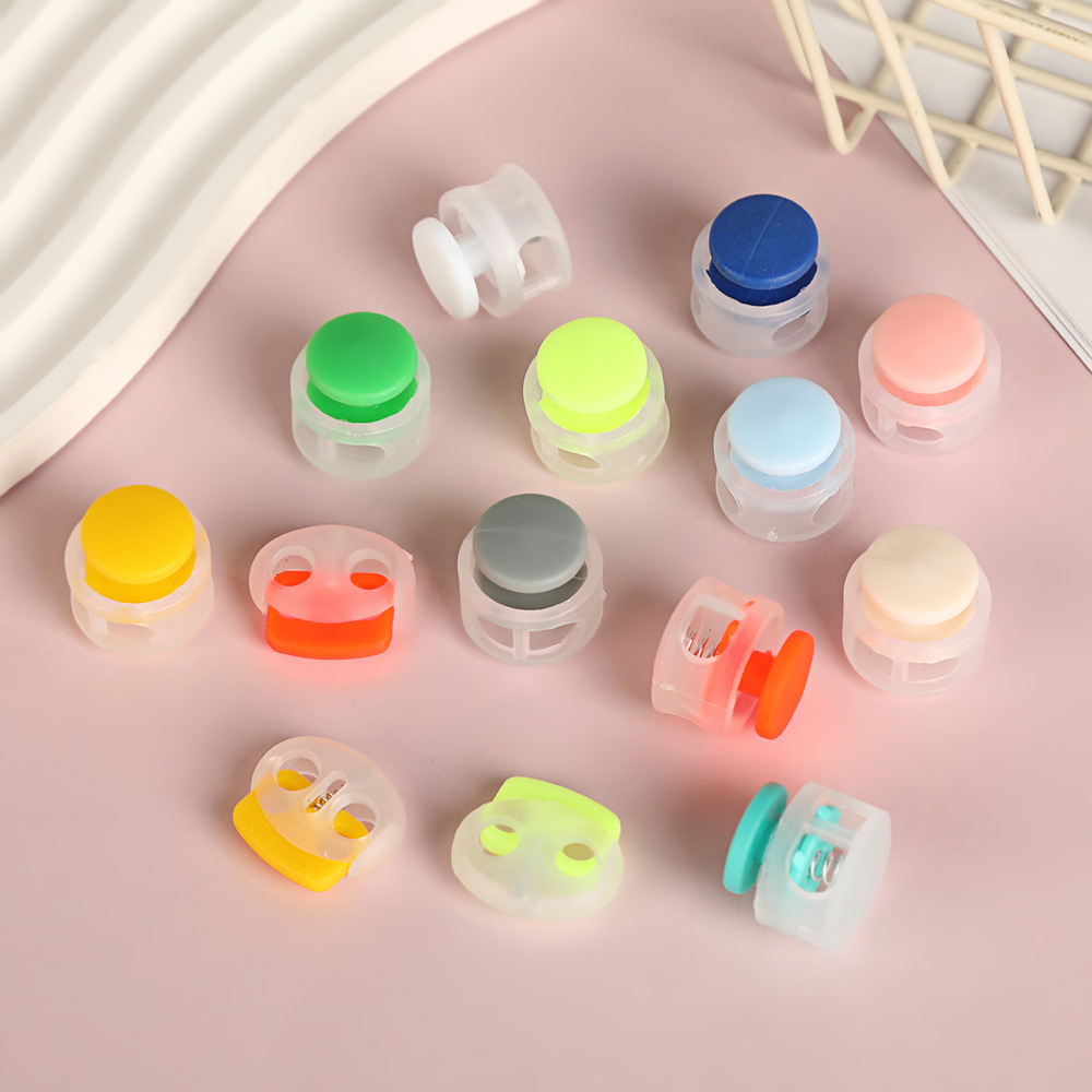 Colored plastic single-hole adjustable button clock cap, double-hole circular string button material, spring buckle, adjustable buckle, anti-slip Specification image
