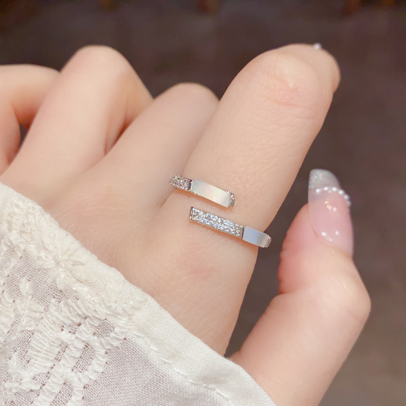 This is a unique, fashionable and simple design zircon mother-of-pearl open ring with a touch of luxury and sophistication for women. It is an adjustable index finger ring