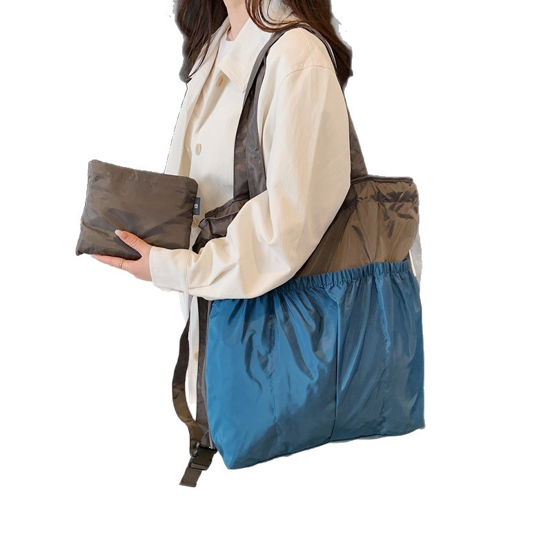 新款单肩包托特双肩折叠包手提简约通勤大容量时尚便携白底实物图