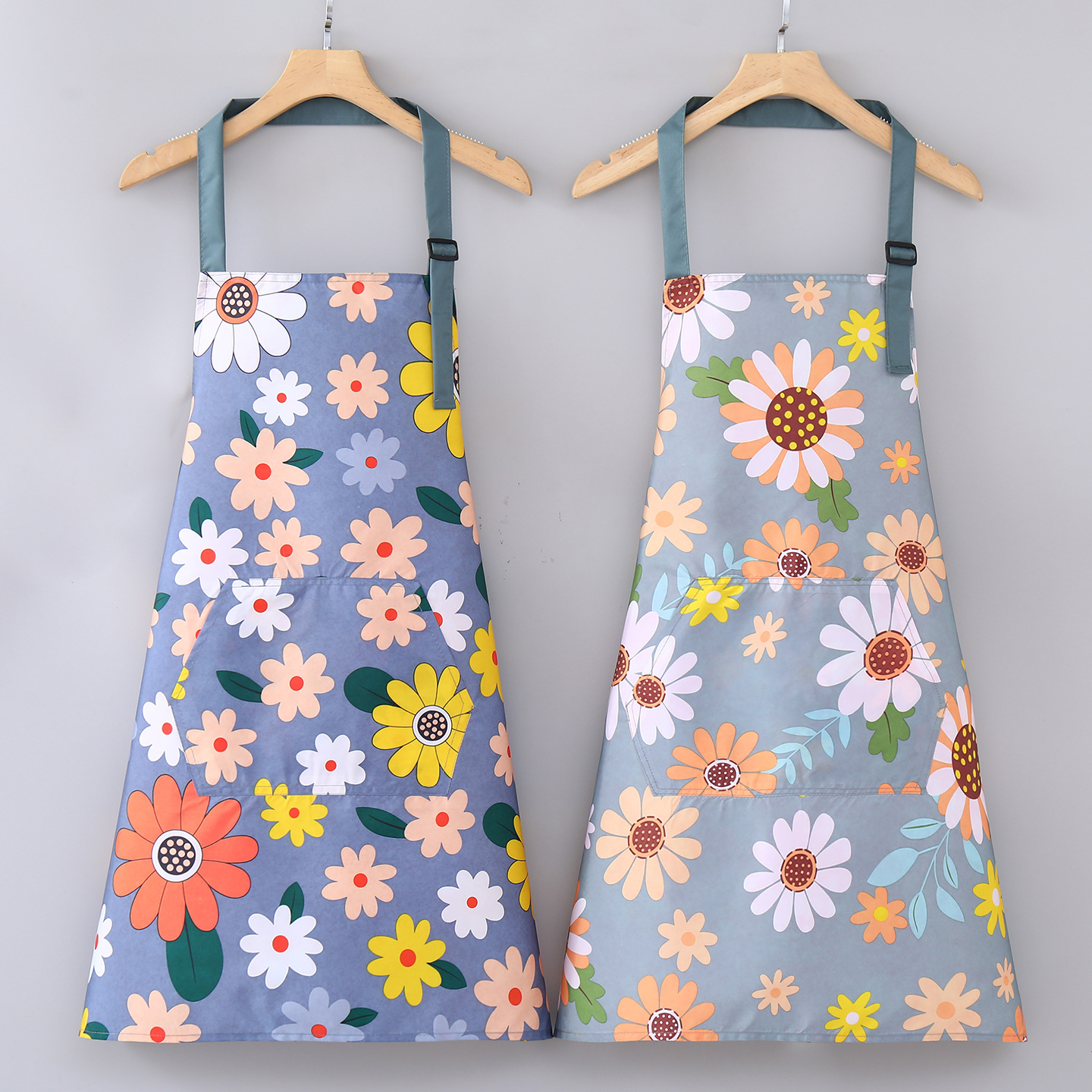 A long-sleeved fashionable women's apron with blue floral patterns