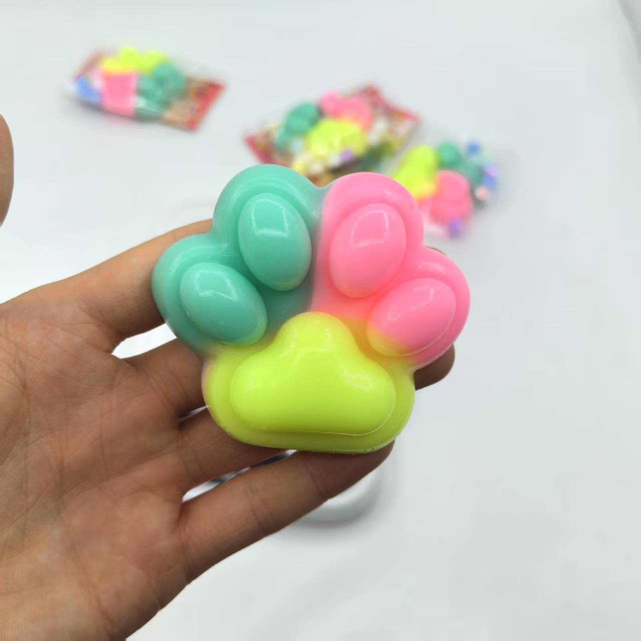 Direct sales from the manufacturer of the new cross-border stress-relieving product, macaron three-color Cat Paw Pinching Fun children's toy Application Scenario