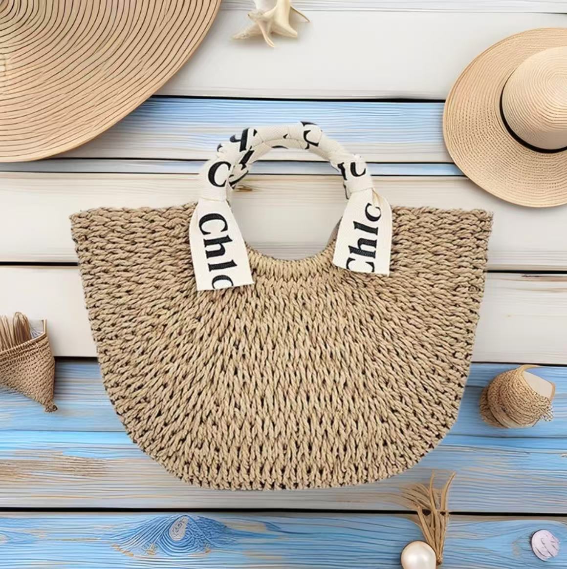 现货批发复古草编包圆斗包编织包草编编织字母丝带沙滩包女包
