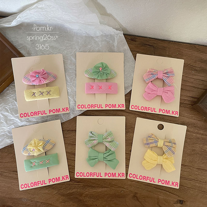 New Korean-style sweet beauty checkered fabric bow hair clip, handcrafted for children, fully wrapped side broken hair duck clip hair accessory for women Application Scenario