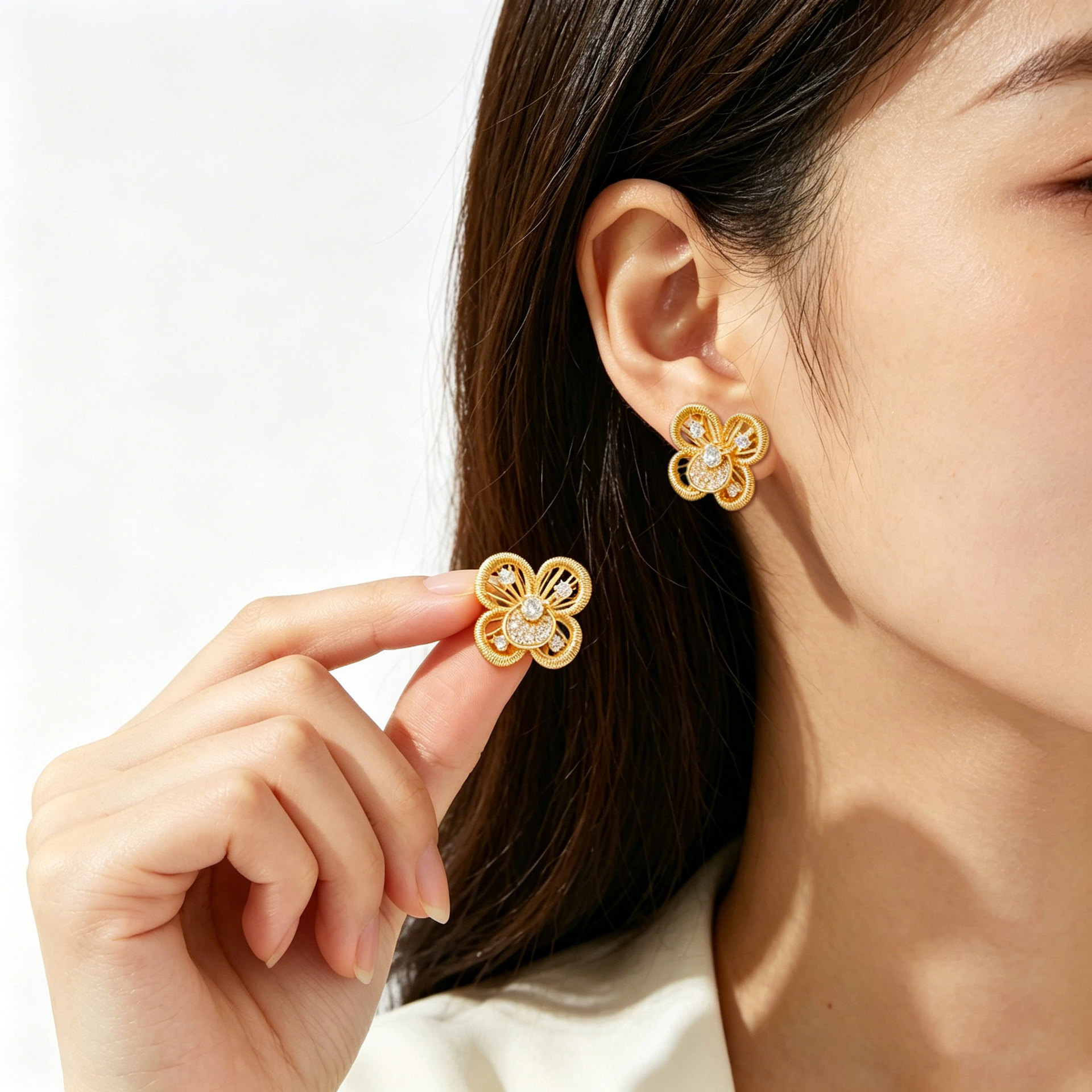Light luxury hollowed-out four-petal flower stud earrings, copper alloy, real gold electroplated with zircon, s925 silver needle, versatile commuting women's earrings