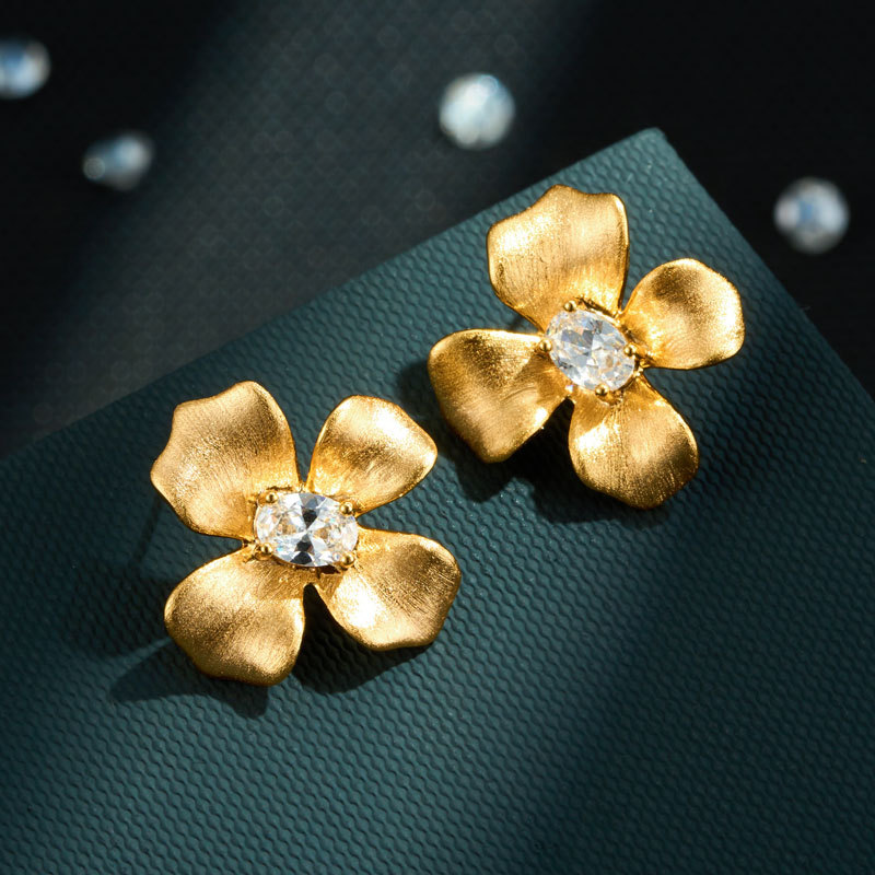 Light luxury style brushed four-petal flower stud earrings, copper alloy, real gold electroplated with zircon s925 silver needle, high-end women's earrings Application Scenario