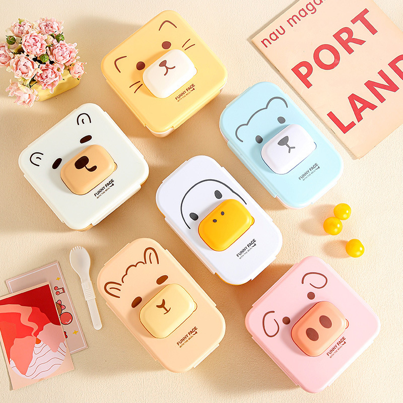 Cute compartments student lunch box that can be heated in a microwave oven. Home cartoon bento box. Office worker lunch box with tableware Specification image