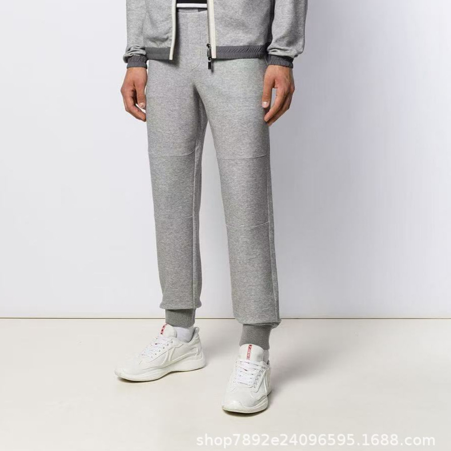 The European station's autumn collection features a new trend of simple and fashionable embroidered color-blocking, tight-waisted, drawstring, and tight-fitting men's business casual pants Specification image
