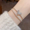 This exquisite, fashionable and light luxury zircon heart-shaped double-layer open bracelet from Japan and South Korea is unique, versatile, and exudes a high-end and dazzling charm. It's a perfect accessory for women details Picture