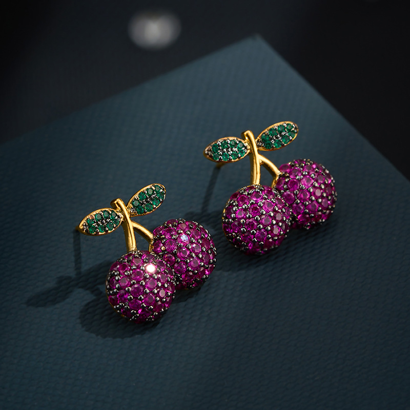 The source factory Heavy industry's three-dimensional cherry ear studs are made of copper alloy with two-color gold plating and micro-inlaid zirconium s925 silver needle earrings Application Scenario