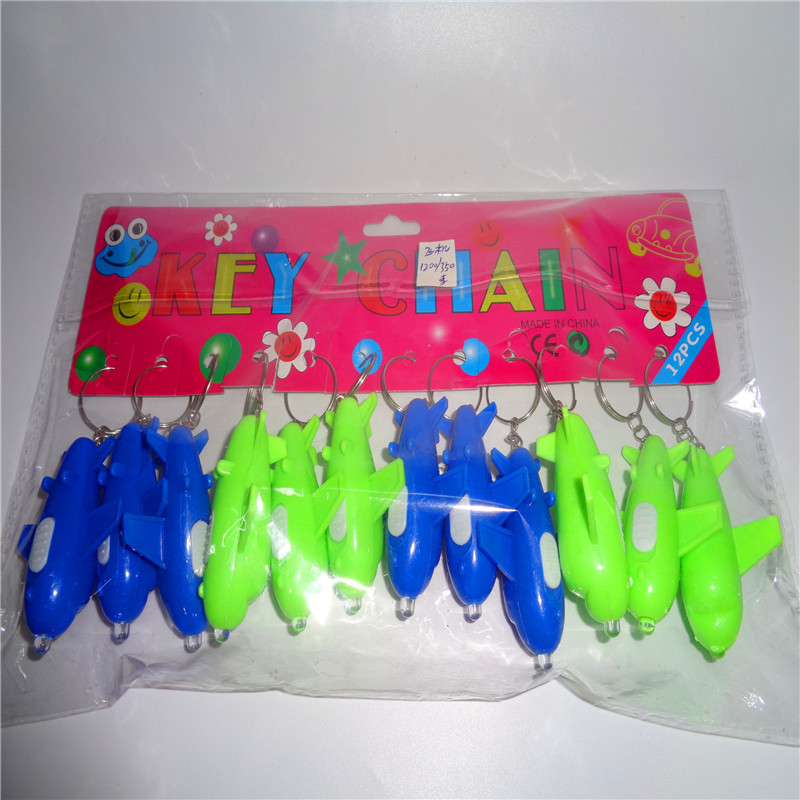 Niños juguetes de plástico linterna regalo pequeño llavero LED pequeña luz de noche aviones stand fuente fabricante al por mayor