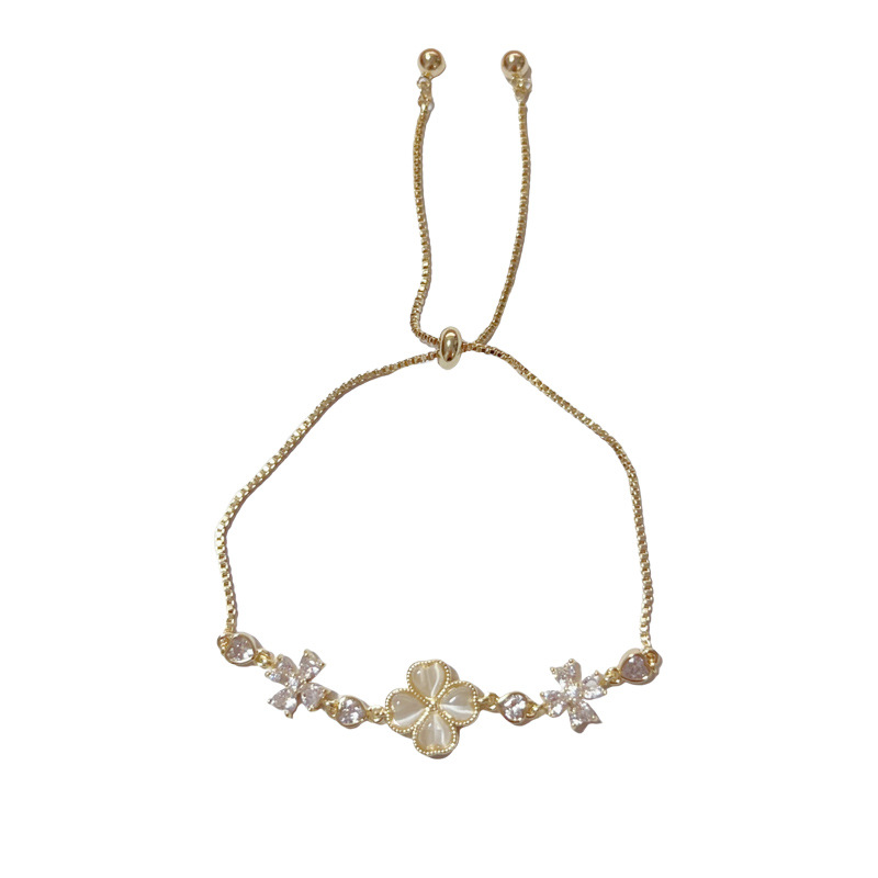 Summer new light luxury diamond-encrusted four-leaf flower bracelet, pull-out style, fashionable, gentle, versatile and high-end accessory for women Application Scenario
