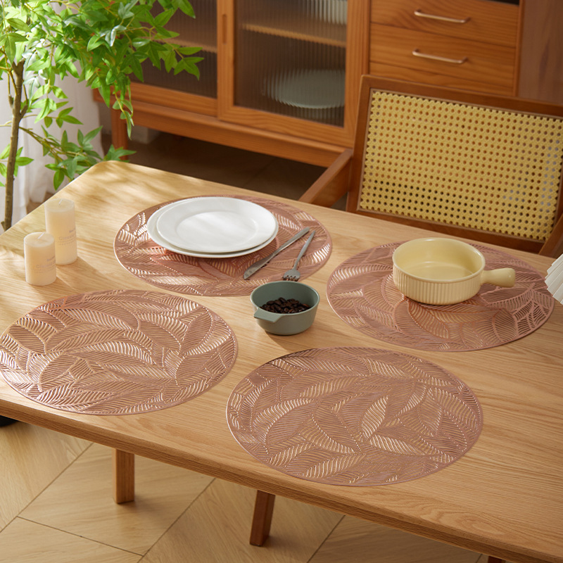 Light luxury round creative leaf hollowed-out gold-embossed silver leaf table heat insulation pad, cross-border pot pad, PVC injection molded heat-resistant details Picture