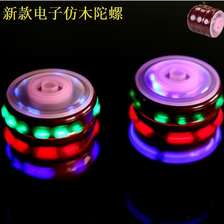 发光电子仿木陀螺 七彩闪光音乐仿木陀螺 地摊货源热卖厂家批发