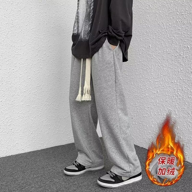 Men's casual pants for autumn and winter are a versatile brand. The straight-leg sport pants with drawstring and loose floor-length pants with fleece are trendy details Picture