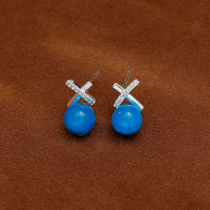 Blue cat's eye stud earrings, a fashionable, light luxury, niche and unique design with a cross-shaped high-end feel, are the latest trend in 2026