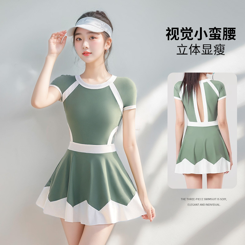 Green one-piece swimsuit models showcase long-sleeved, sexy backless sportswear for women. Summer sun protection fabric 107060