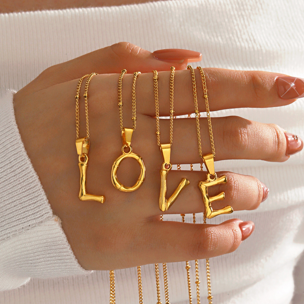 This is a trendy stainless steel 26-letter necklace with an InS-style niche design that is versatile. It features a bamboo joint letter collarbone chain Specification image