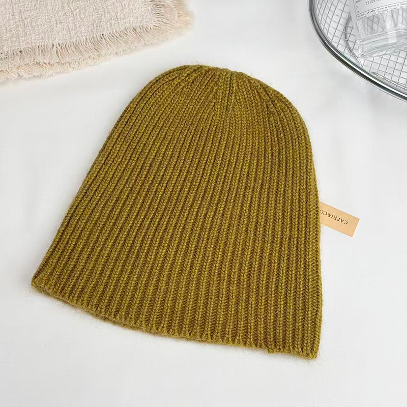 Raccoon wool European and American fashionable warm hat, knitted woolen women's ear cap, winter women's face-showing small bun, trendy solid color details Picture