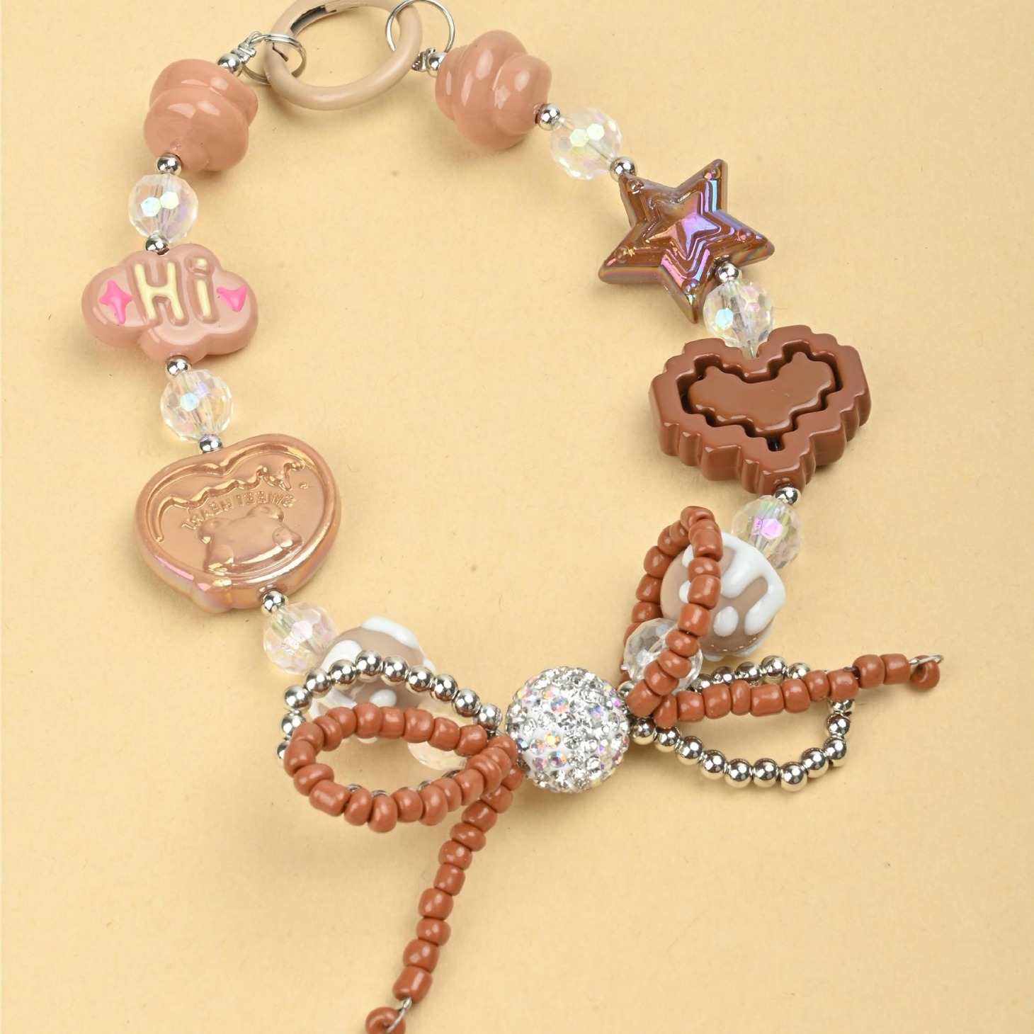 Wholesale of irregular handcrafted beaded diamond balls, double-layer bow ties, mobile phone chains, keys, bags and pendants in the Japanese and Korean ins style Specification image