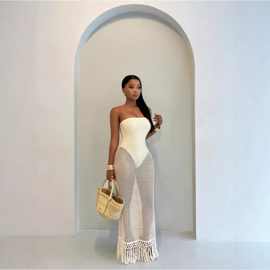 The 2026 cross-border European and American women's beach summer crocheted mesh tassel dress with a false two-piece design full figure