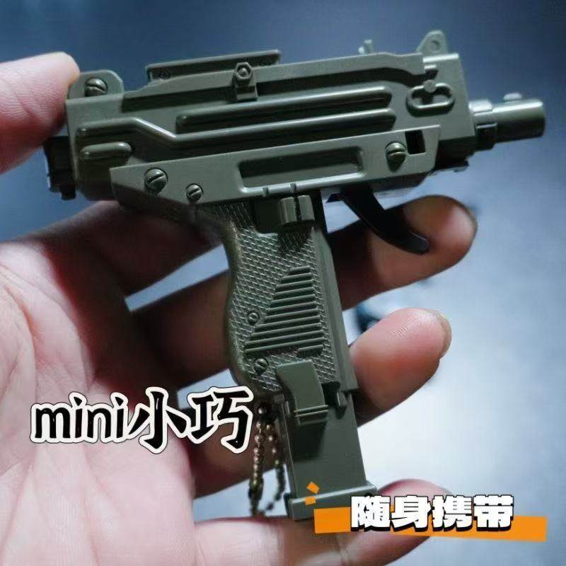 Mini pendant gun uzi keychain Men's Peace Elite Battle royale Gun peripheral metal pendant toy small gun details Picture