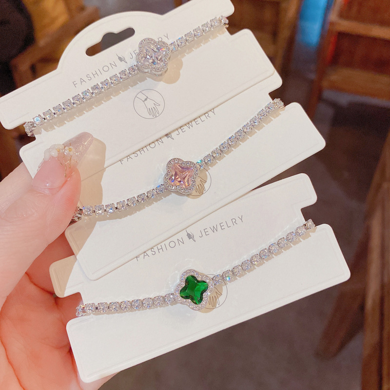 The 2023 summer new micro-inlaid zirconium four-leaf flower bracelet is a unique, luxurious and elegant adjustable jewelry item for female Internet celebrities