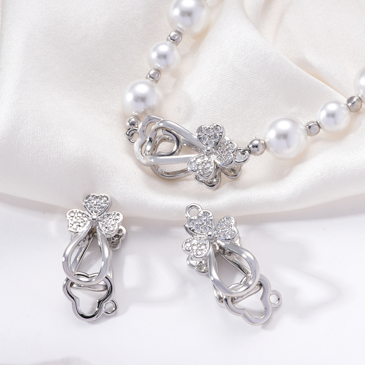 Copper plated with palladium, white gold and zirconium, clover flower elastic buckle, pearl necklace buckle, sweater buckle, DIY accessory