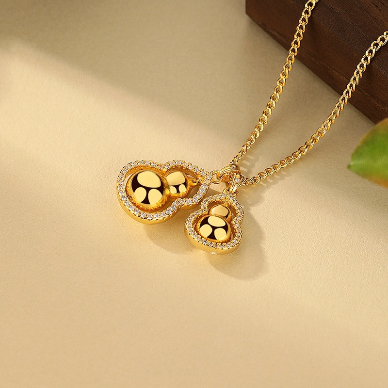 The same style of rotatable double gourds stacked pendant, traditional Chinese style sand gold sweater chain gourd pendant necklace Application Scenario