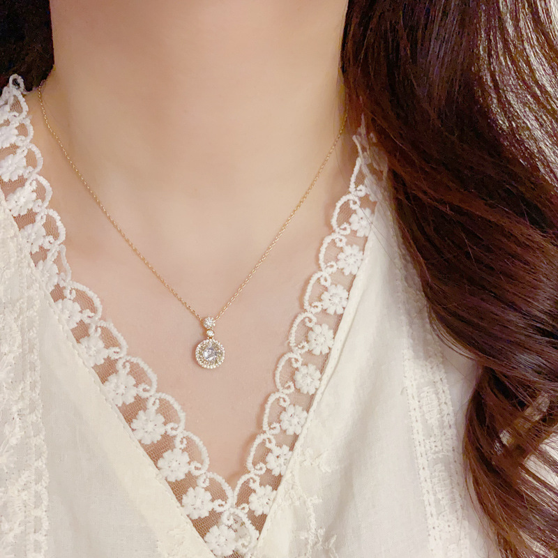 Wholesale of trendy, light luxury, versatile, super shiny zirconium ring pendant necklace set, simple and elegant commuting earrings