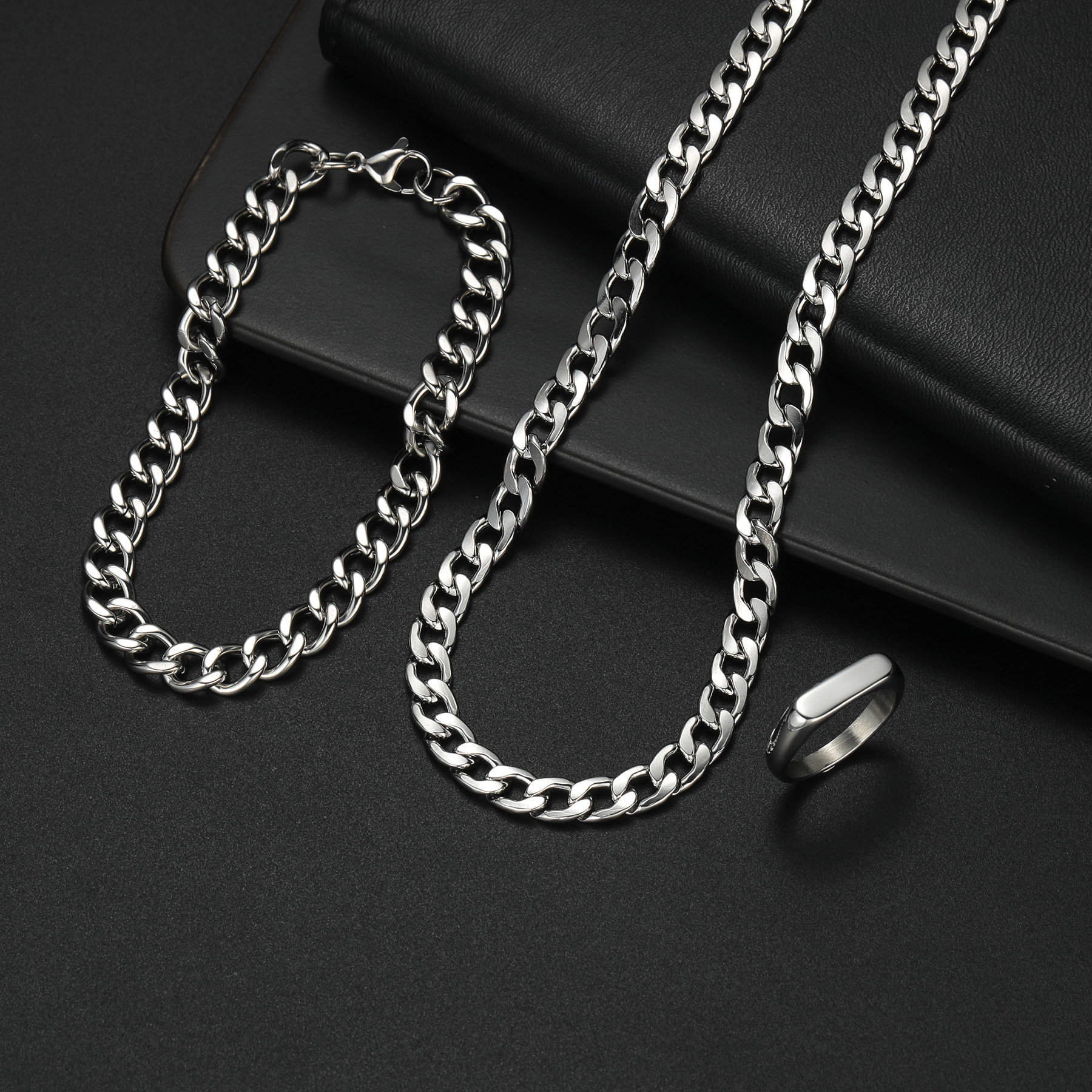 A three-piece titanium steel necklace and bracelet set with a neutral hip-hop style from Europe and America, a cross-border bestseller from Shein