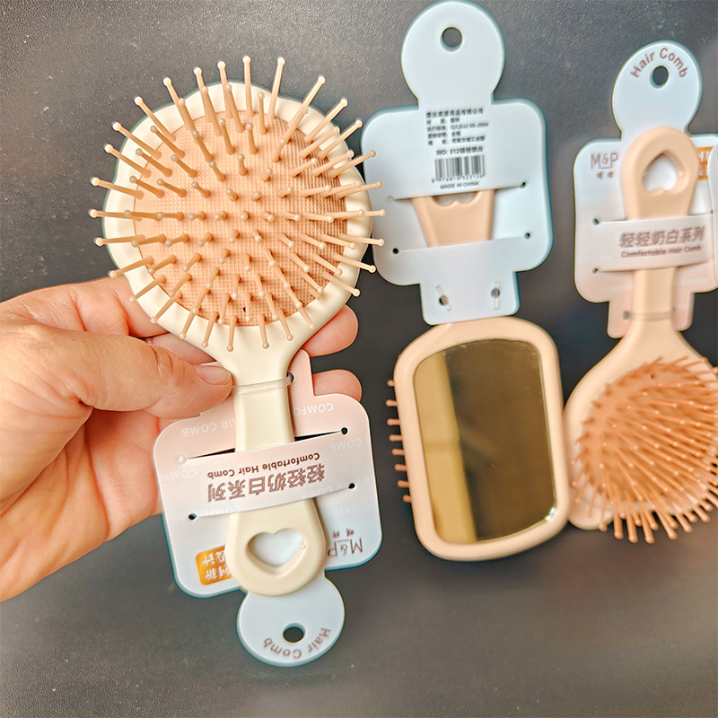 【 Zone 2-14 】312 Light Milk White Air Cushion Comb 4/ Pack 480/ box 312 Light Milk White Air Cushion Comb Student Adult Comb with Mirror Comb Convenient to carry Air Cushion Comb 2 yuan wholesale Item Picture